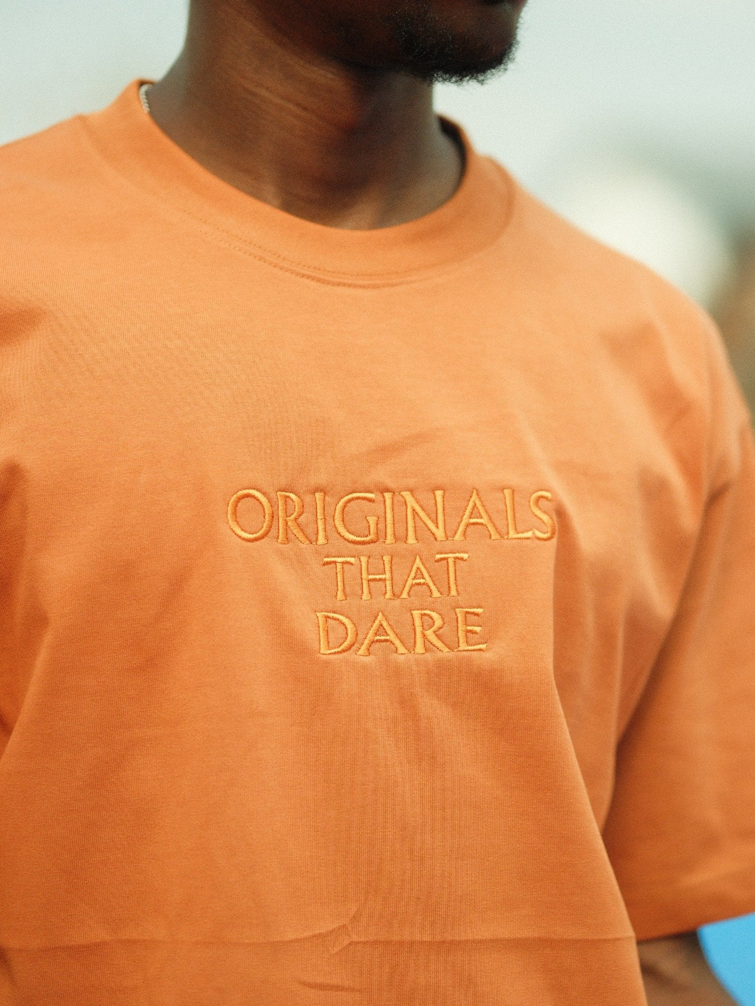 Originals That Dare” Premium Embroidered Tee